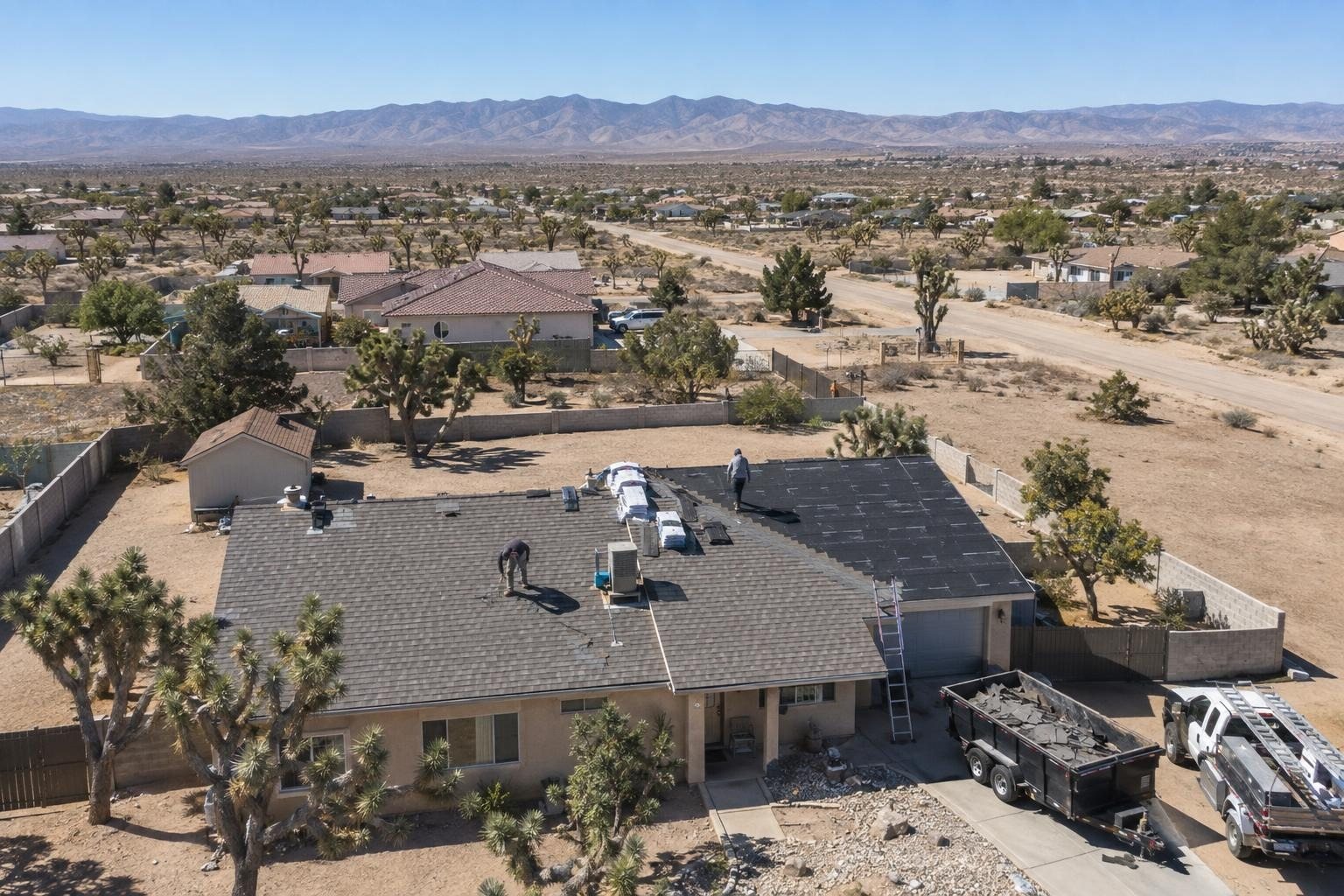 Stucco homes, Joshua trees and low mountains across the High Desert around Hesperia