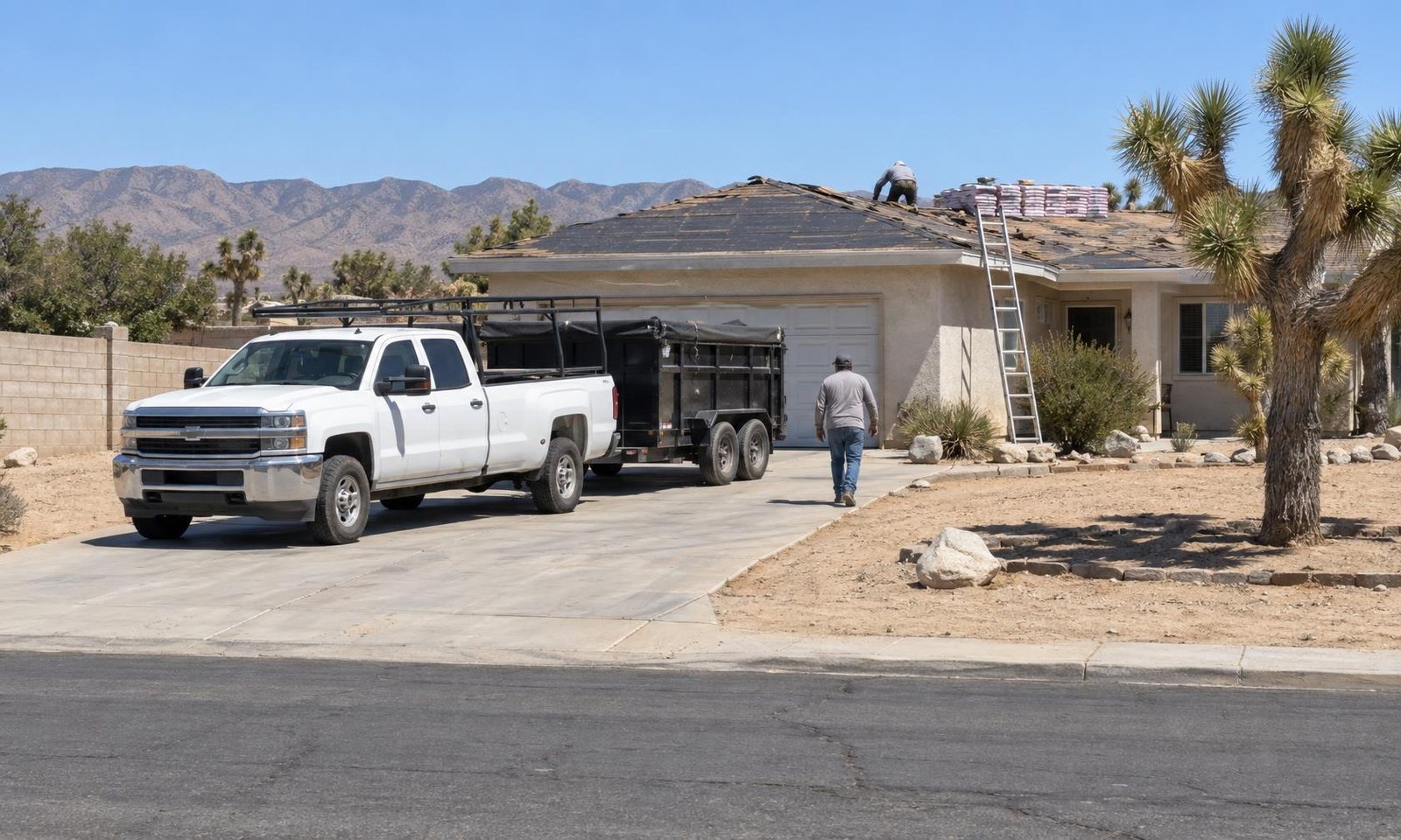 The crew’s white pickup and dump trailer parked at a job, ladder up against the house